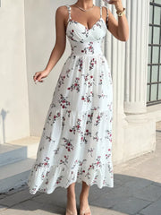 White floral spaghetti-strap tiered midi dress shown from the front