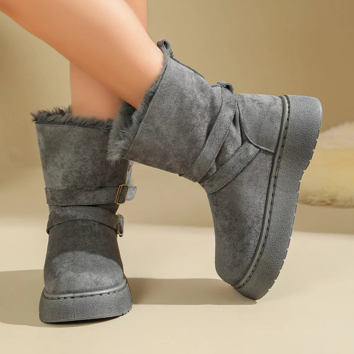 Gray boot with two buckle straps shown from side