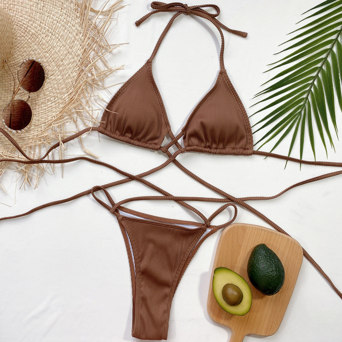 Brown crisscross bikini modeled in a seated pose