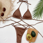 Brown crisscross bikini modeled in a seated pose
