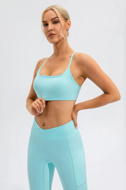Aqua cami styled with matching leggings, angled front