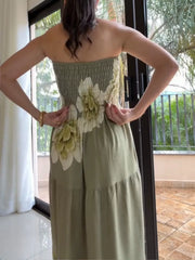 Back view of the strapless green floral maxi dress with smocked bodice.