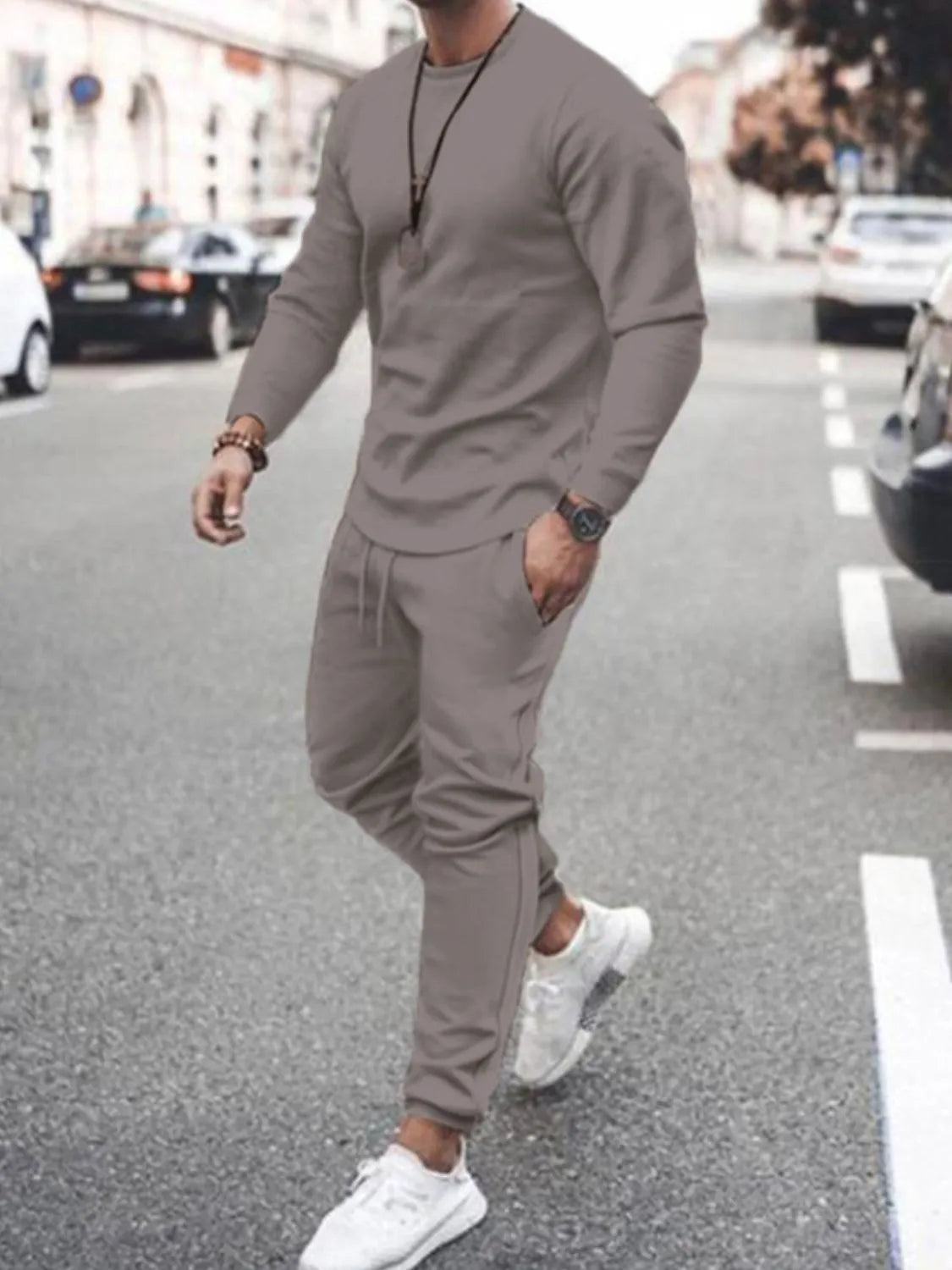 Model wearing light taupe long-sleeve top and jogger pants set