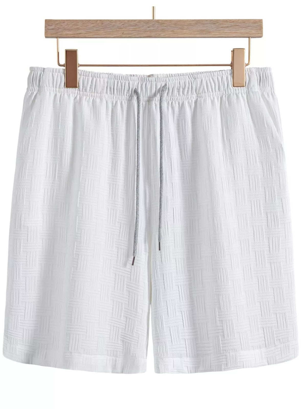 White textured shorts with elastic waist and drawstring, front view