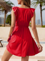 Back view of red sleeveless mini dress with gathered waist