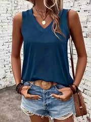 Model wearing blue tank top with denim shorts