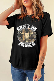 Model wearing black Cant Be Tamed graphic tee