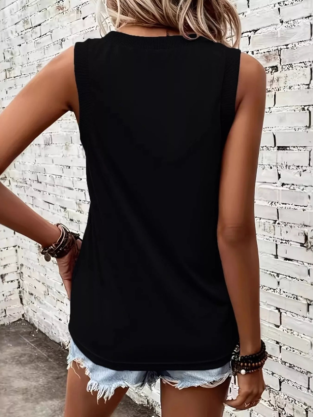 Black V-neck tank top with ribbed trim, front view