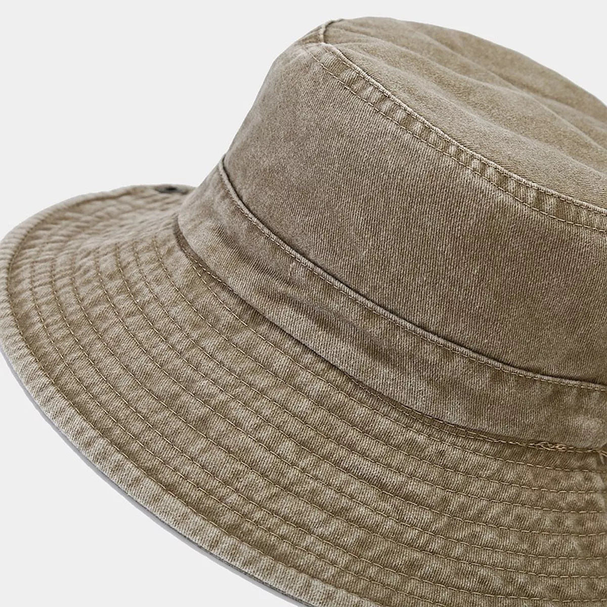 Close-up of the camel bucket hat crown and stitched wide brim