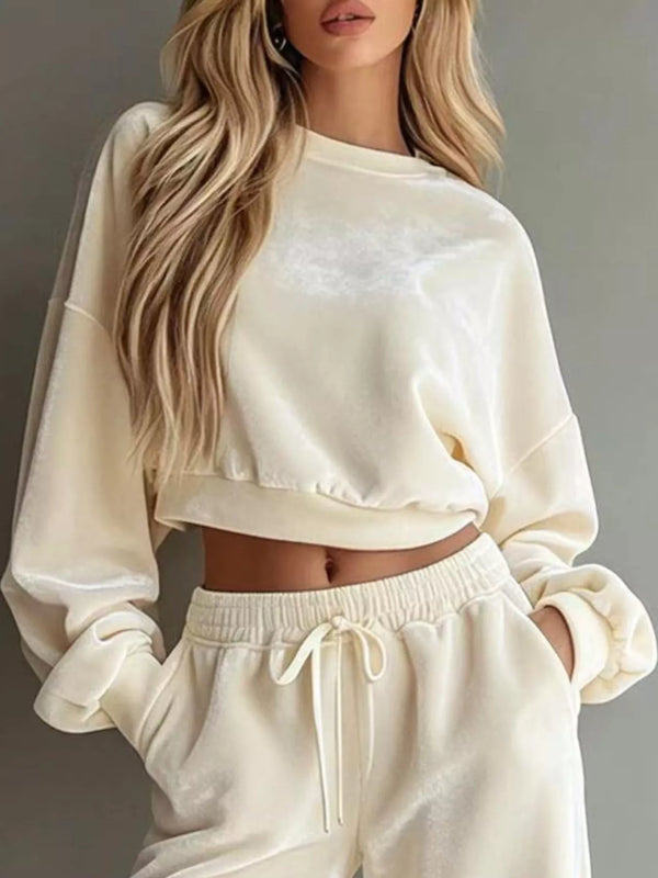 Close view of ivory cropped sweatshirt with matching drawstring pants