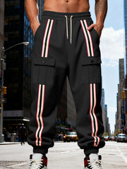Front view of black striped cargo joggers with drawstring waist and flap pockets