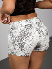 Rear angled view of grey leopard-print shorts showing two back patch pockets