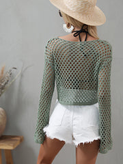 Sage green openwork cropped cover-up shown with long bell sleeves and a round neckline.