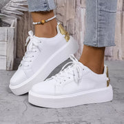 Side view of white lace-up sneakers with thick platform soles