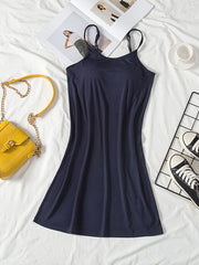 Dark navy cami dress laid flat with a fitted bodice and flared skirt