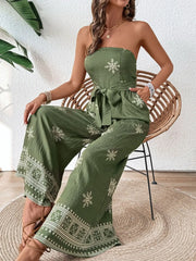 Seated pose showing printed wide legs and hem
