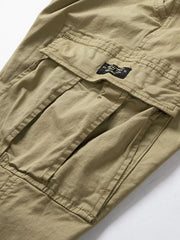 Close-up of khaki cargo pants side pocket and fabric label