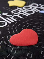 Close-up of colorful heart graphic and lettering on black T-shirt