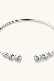 Silver bracelet with moissanite stones shown on a wrist