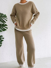 Front view of the taupe knit set with both hands resting near the hips.