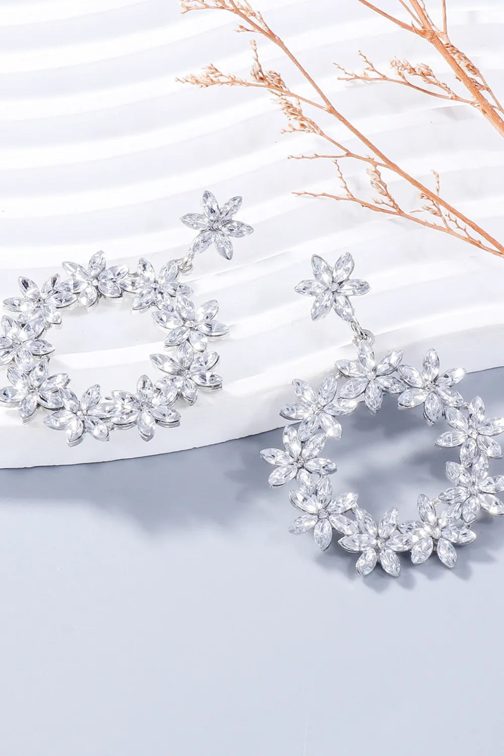 Pair of silver-tone rhinestone flower dangle earrings
