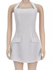 White halter mini dress displayed on a mannequin, showing the front seams and flap pocket details.
