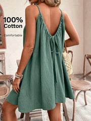Mint green gauze dress showing low back and tie