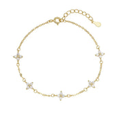 Gold-tone four-leaf clover bracelet arranged flat
