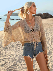 Tan crochet tie-front cover-up with wide sleeves, beach styling