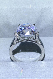 Profile view of a large round moissanite solitaire with a tall prong setting.