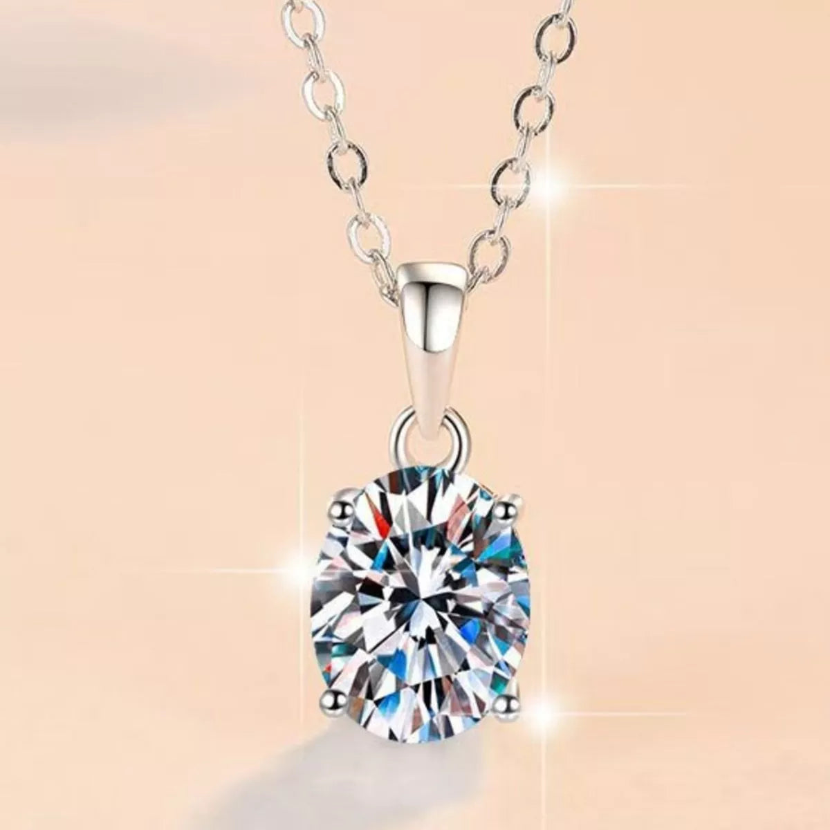 Front view of round moissanite pendant on silver chain