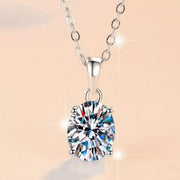 Front view of round moissanite pendant on silver chain