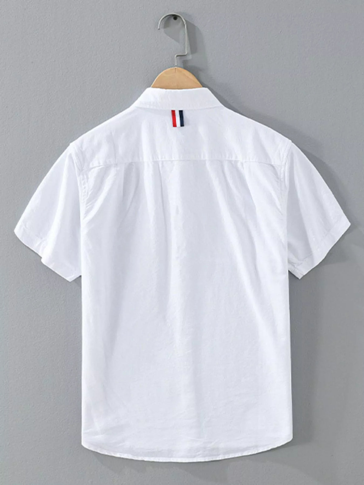White short-sleeve button-up shirt with contrast stripe across the chest and collar