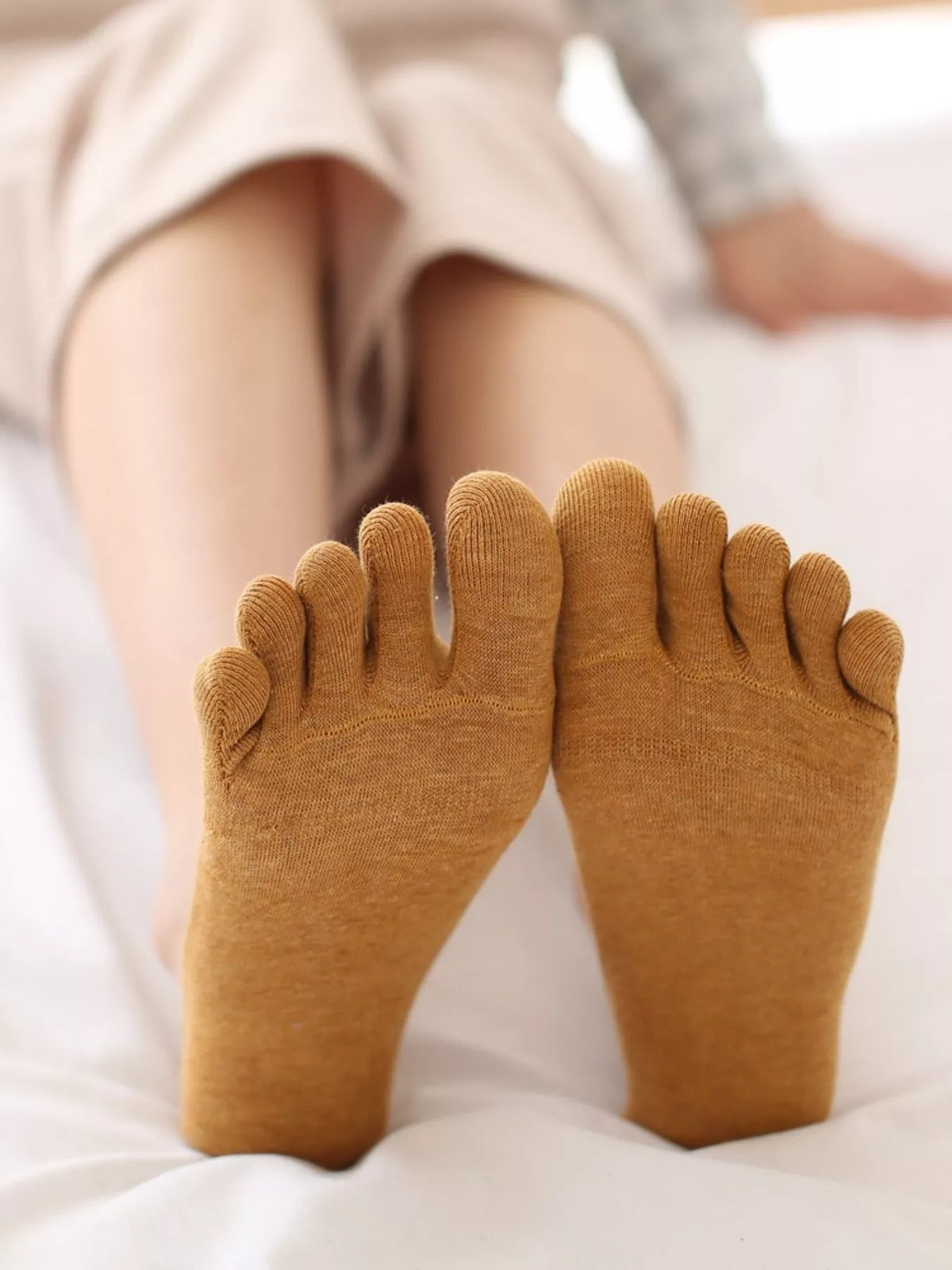 Ochre five-toe socks shown with separated toe pockets