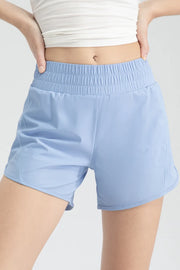 Front close-up of light blue active shorts with a wide elastic waistband