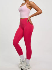 Dusty pink active bra shown from back with cross straps