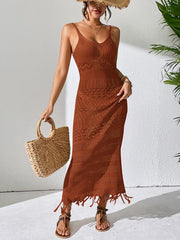 Front view of a rust openwork cover-up dress with thin straps and a fringed hem
