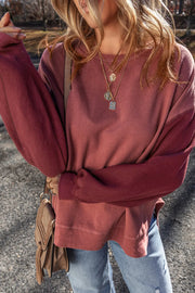 Close view of mauve sweatshirt front and sleeve