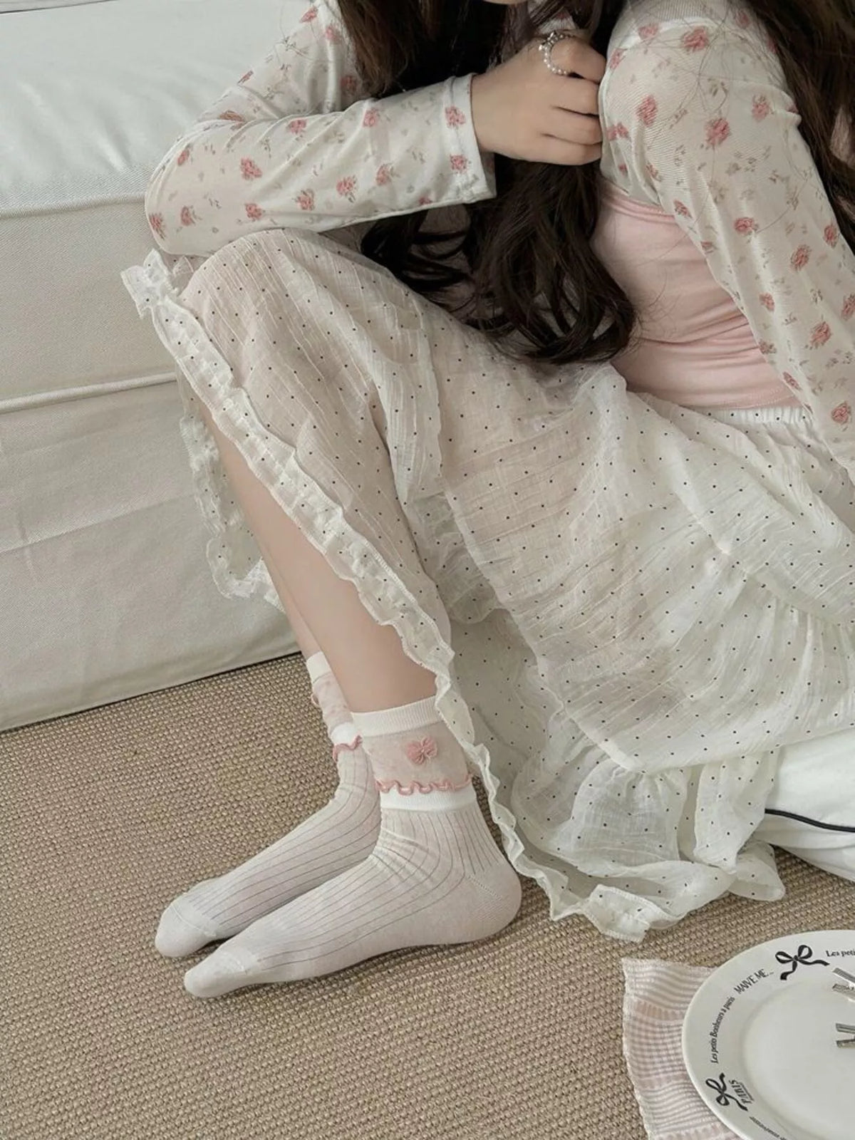 Model seated wearing the socks