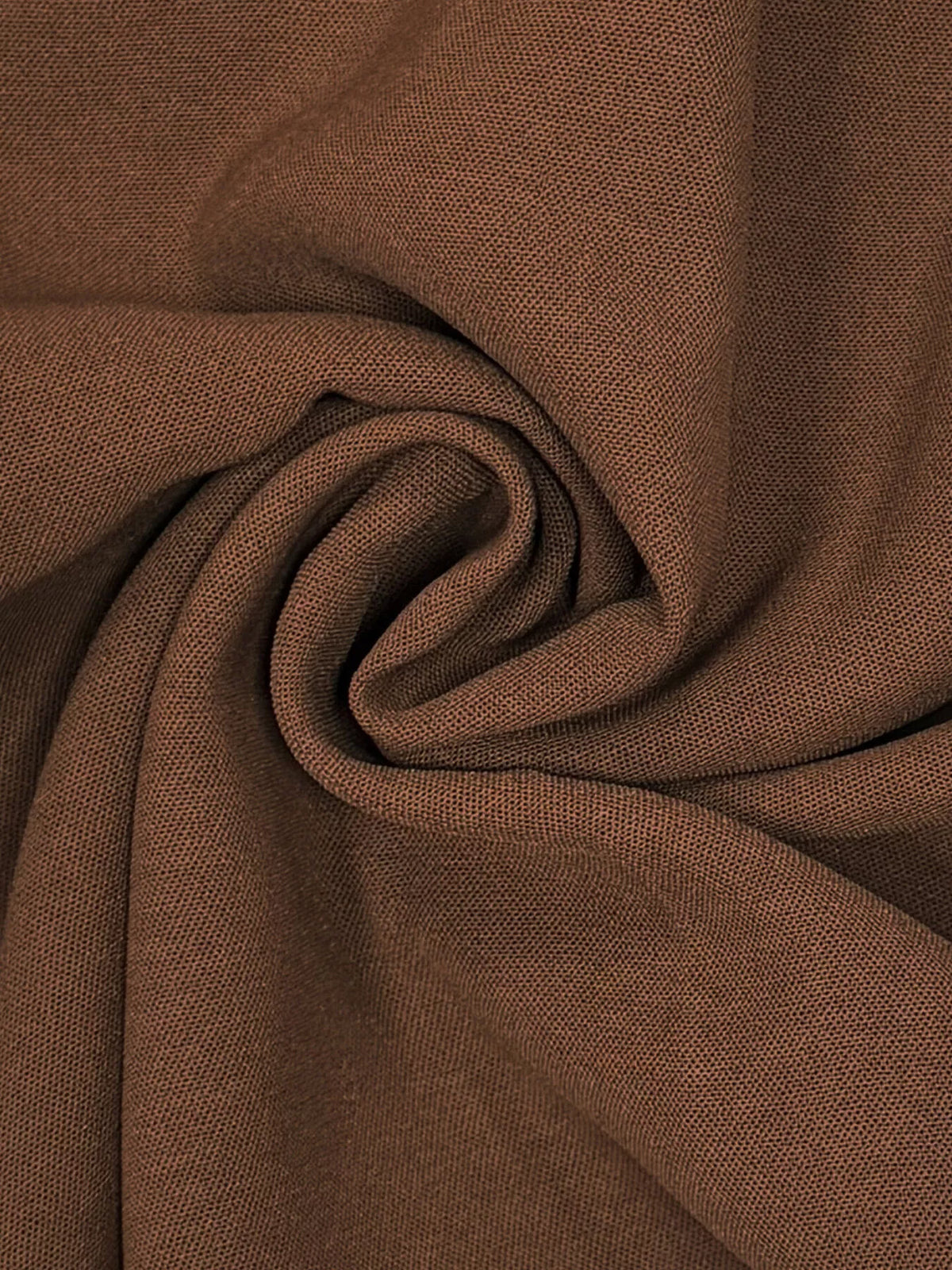 Close-up of brown jumpsuit fabric texture