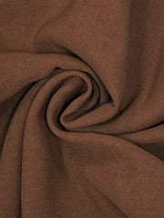 Close-up of brown jumpsuit fabric texture