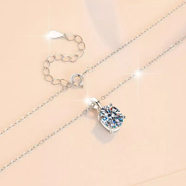 Sterling silver necklace with round moissanite pendant and extension chain