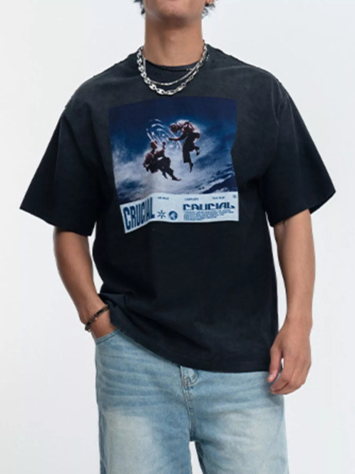 Model wearing black oversized graphic T-shirt with blue print