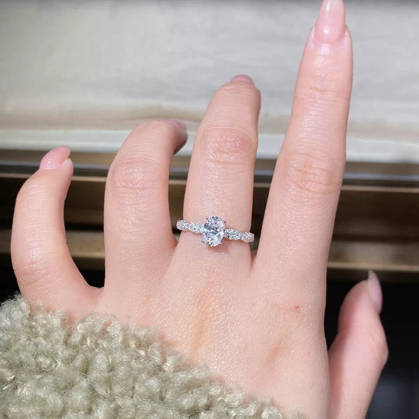 Close-up of the oval stone set in a polished silver ring