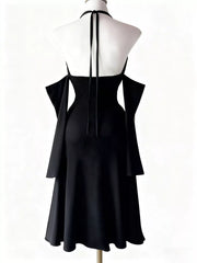 Close-up of black halter dress bodice and deep V neckline