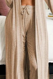 Close front view of tan cardigan, cropped top and drawstring lounge pants