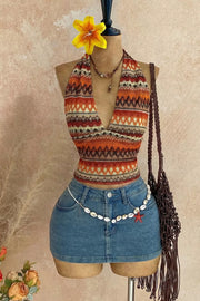 Orange geometric-print halter cami front on mannequin with denim shorts