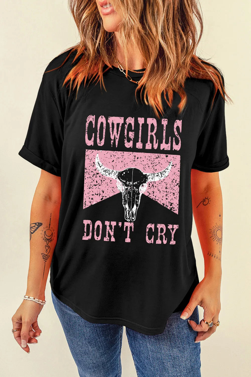 Model wearing black Cowgirls Dont Cry graphic T-shirt, front view