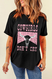 Model wearing black Cowgirls Dont Cry graphic T-shirt, front view