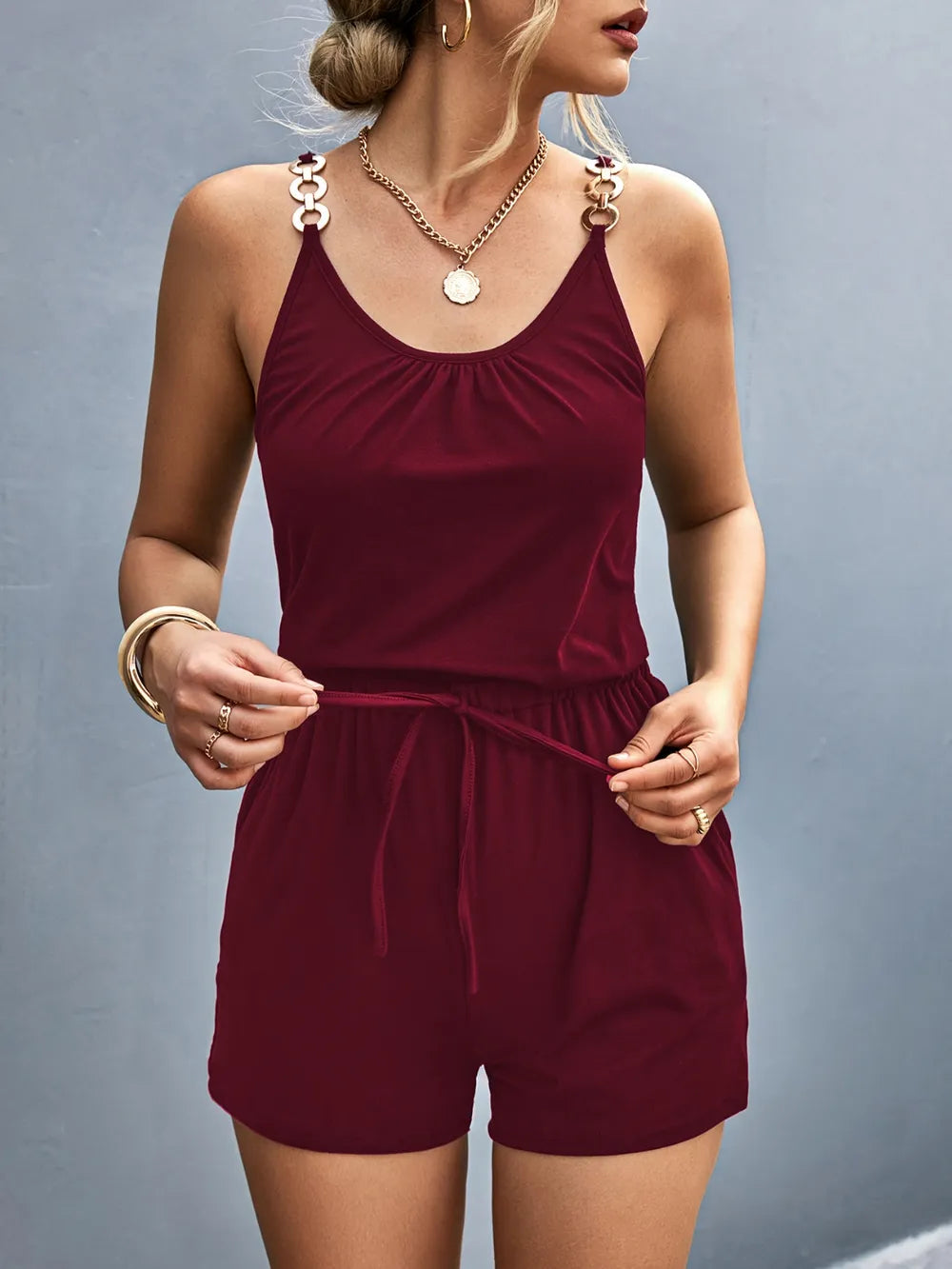 Front view of burgundy romper showing drawstring waist